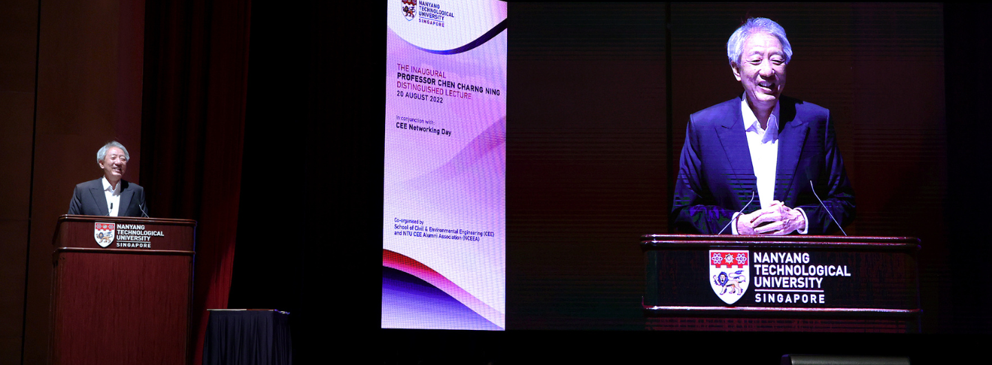 Man at podium with Nanyang Technological University logo, split screen with lecture poster and speaker's close up.